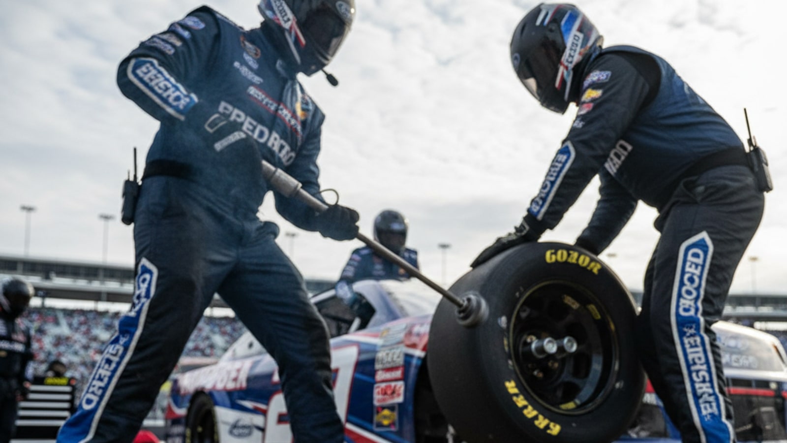 What happens to the lug nuts in a NASCAR pit stop?