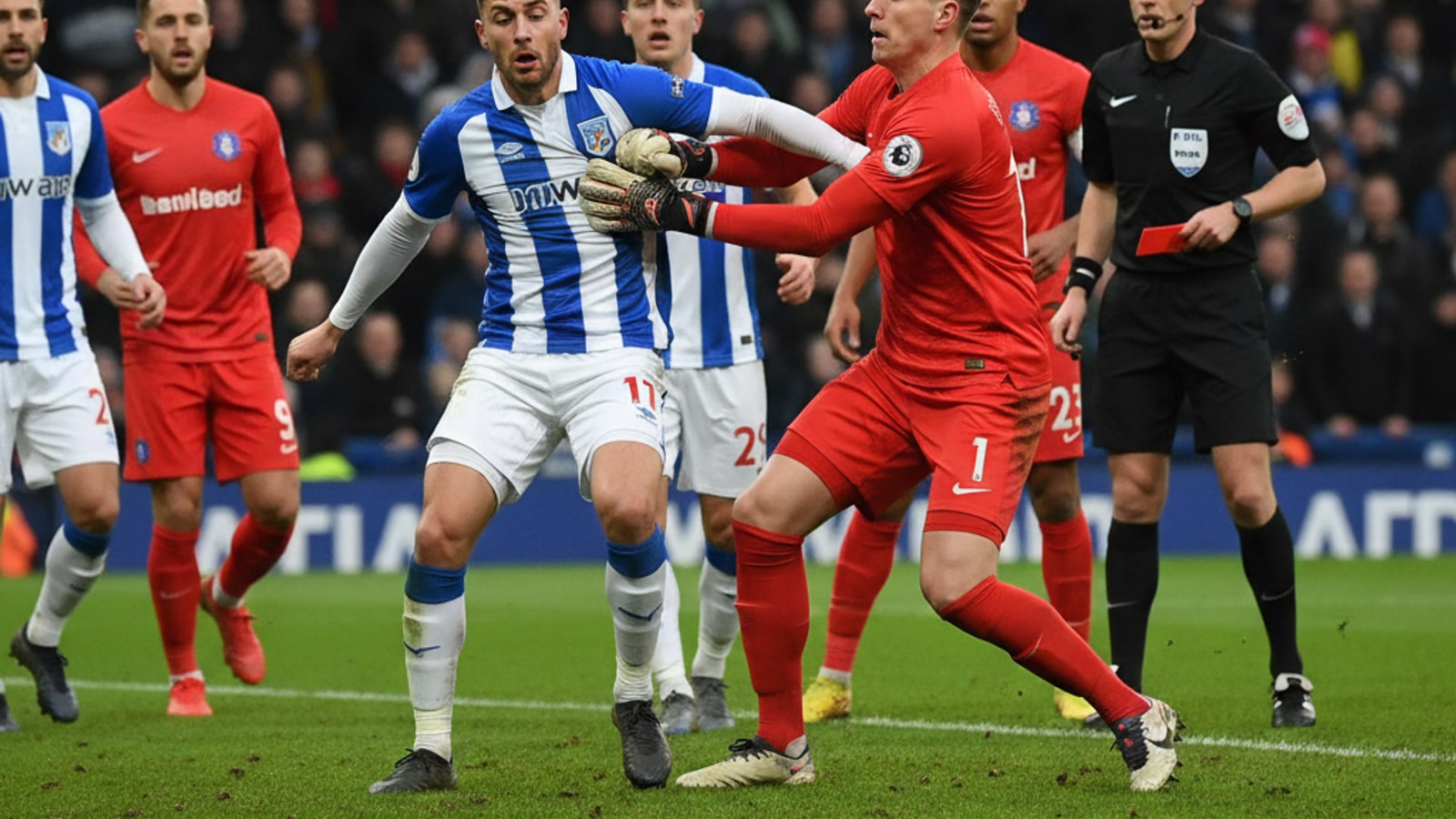 Can a goalkeeper challenge an opponent with his hands?