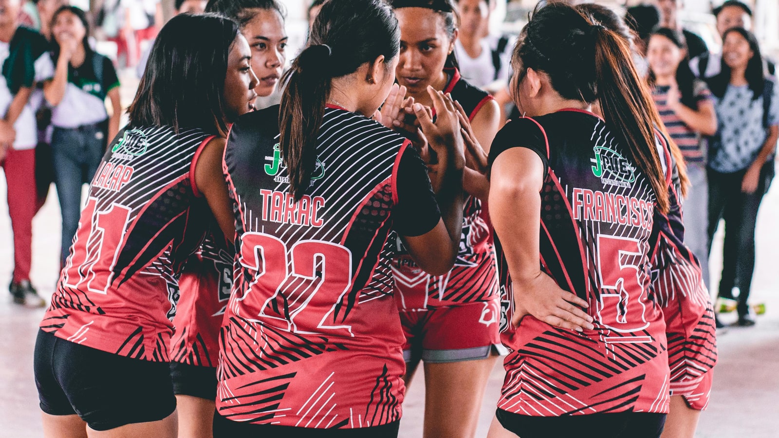 Why does one volleyball player wear a different jersey?