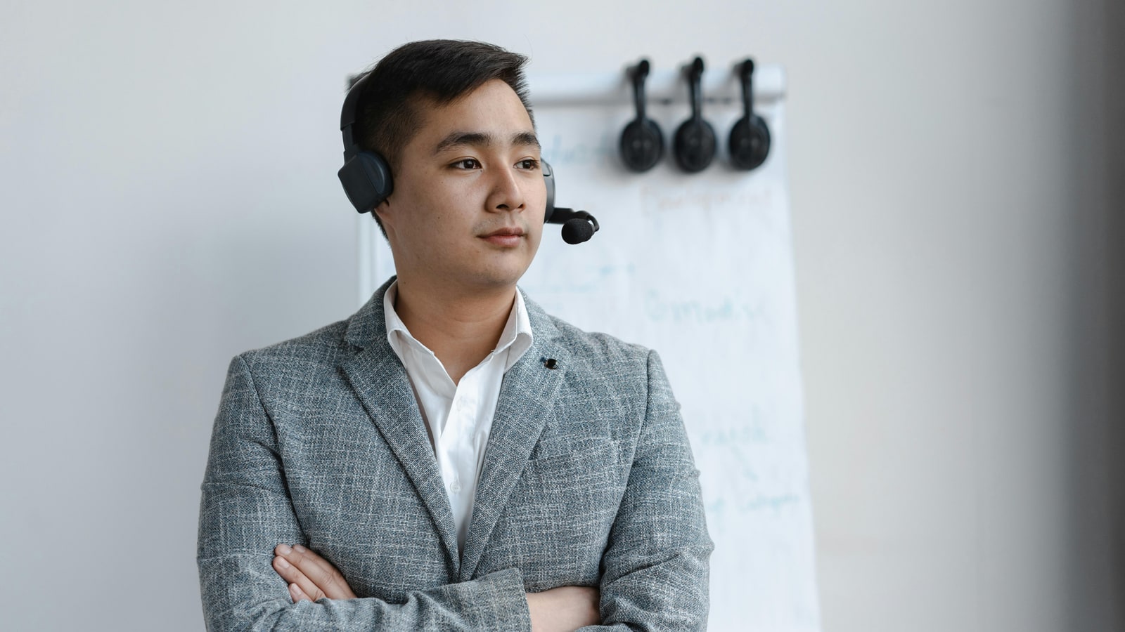 Why do they wear headphones in F1 meetings?