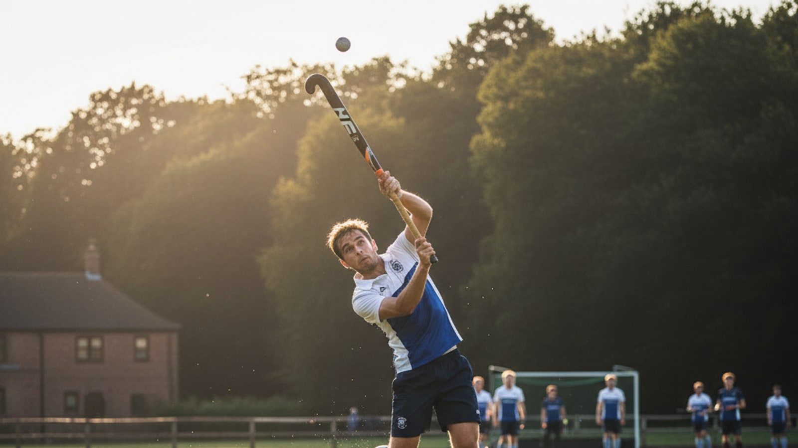 Can a hockey player play the ball above shoulder height?