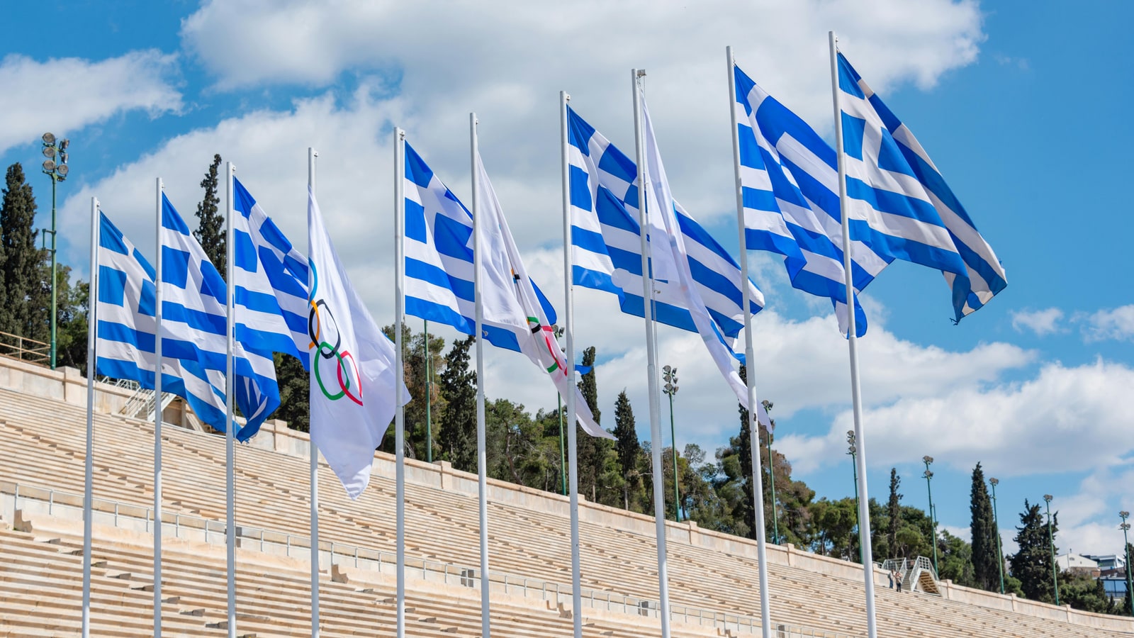 Why did Carter want to move the Olympics to Greece?
