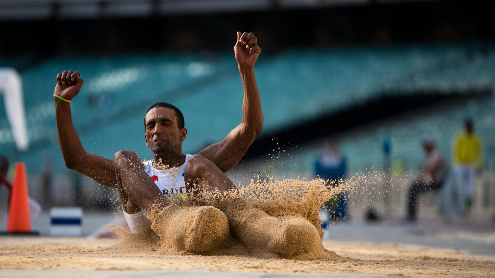 Why are long jump pits made out of sand?