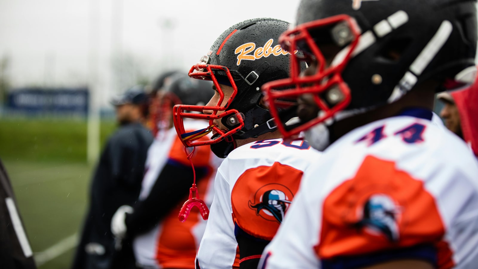 Why do American football players wear Under Armour?