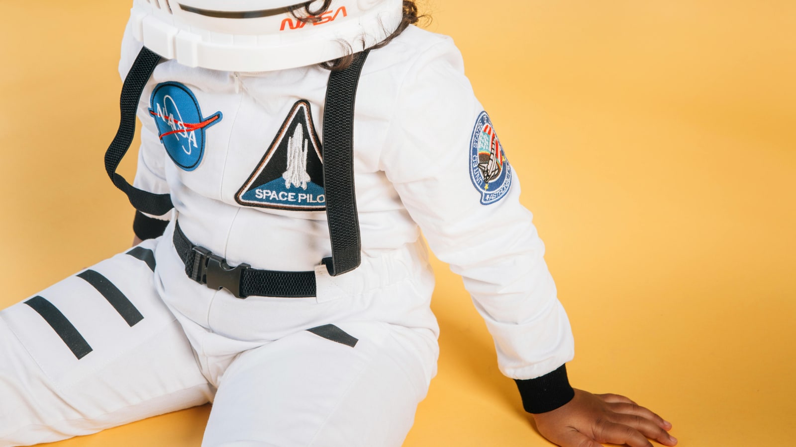 Why do astronauts wear orange suits?