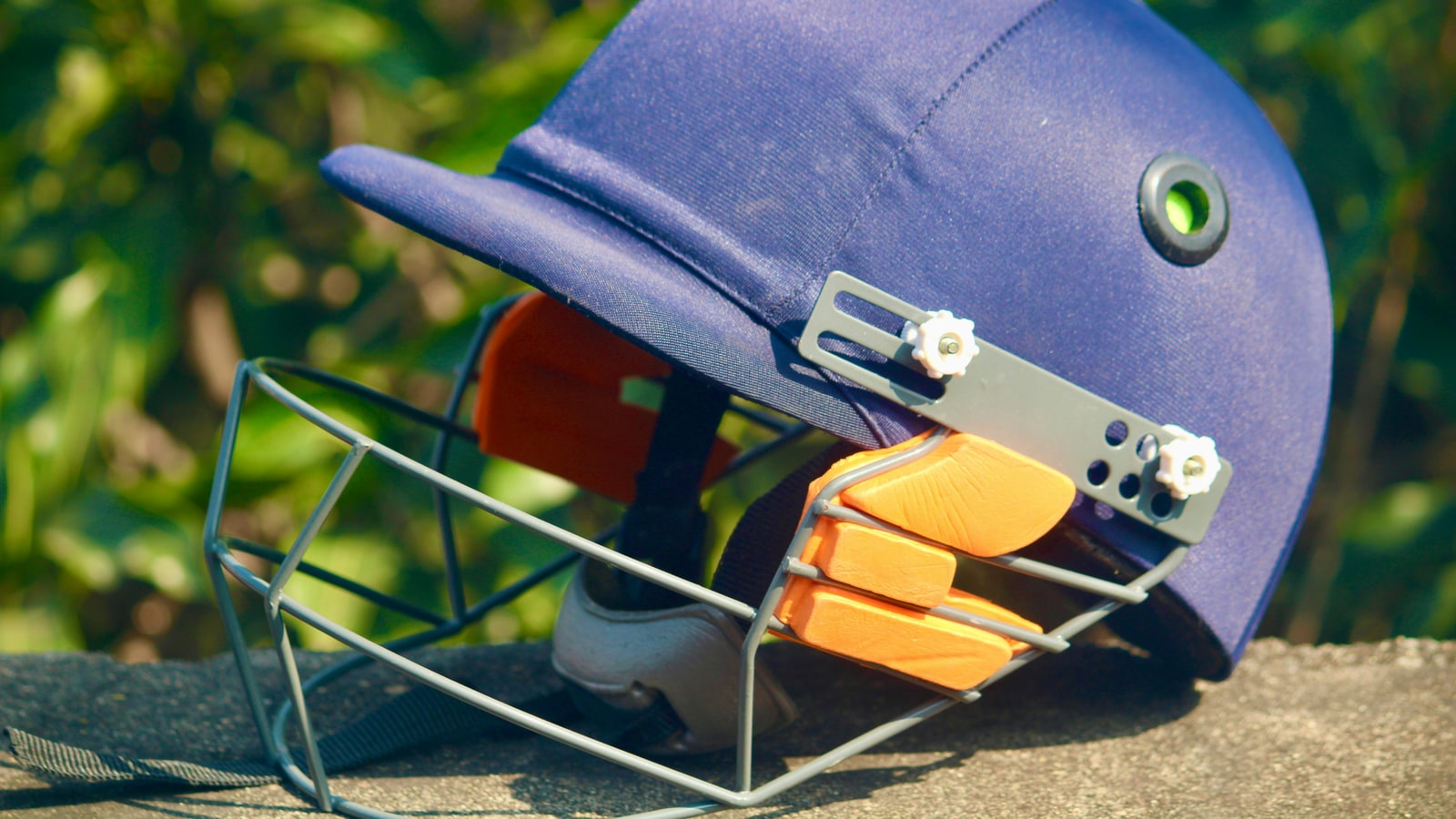 Who was the first cricket player to wear a helmet?