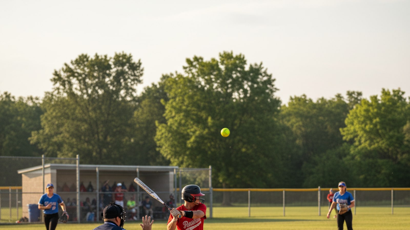 How many strikes and walks are there in softball?