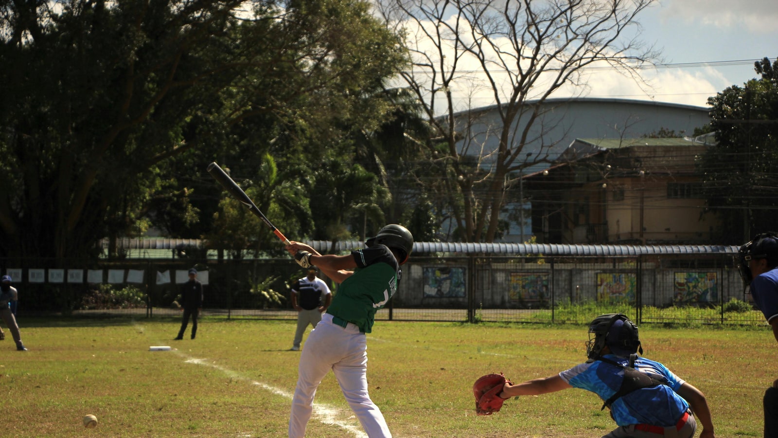 Why does the catcher throw to first after a strikeout?