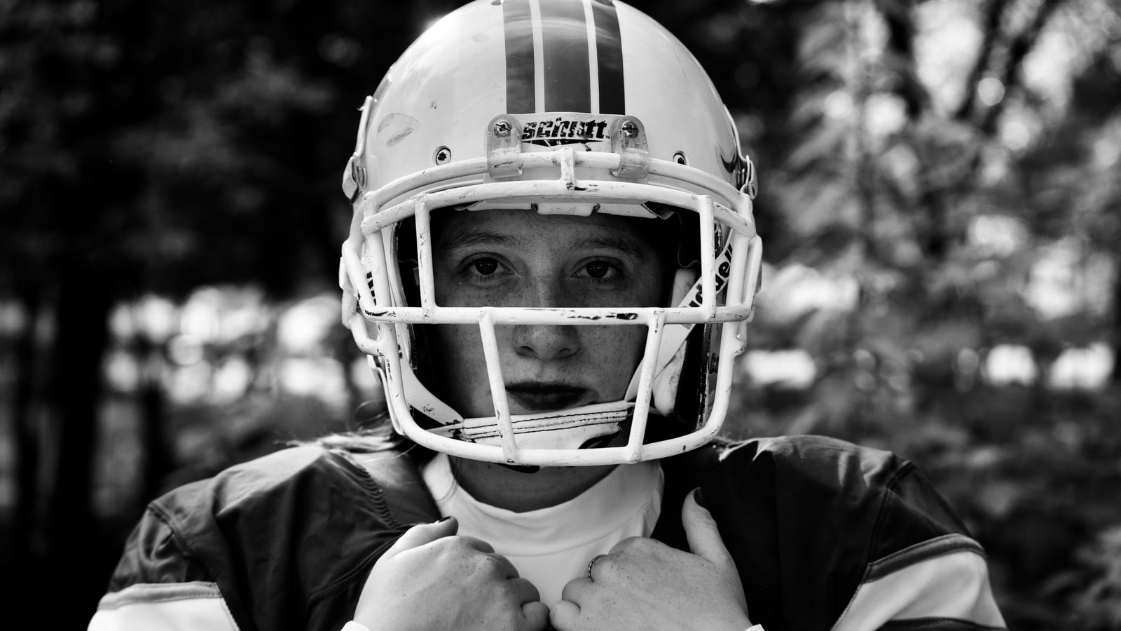 Why do AFL players not wear helmets?