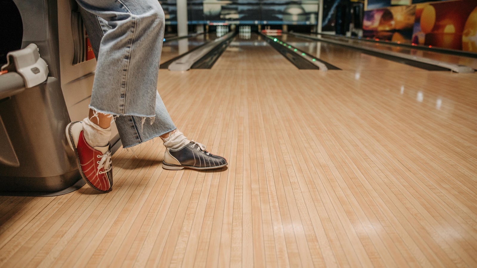Why is it important to wear bowling shoes?