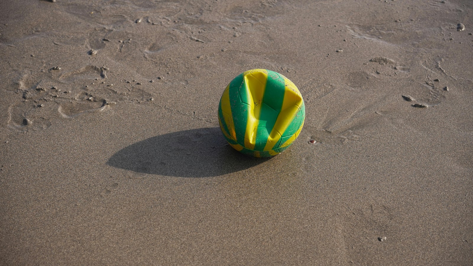 Why do beach balls deflate over time?
